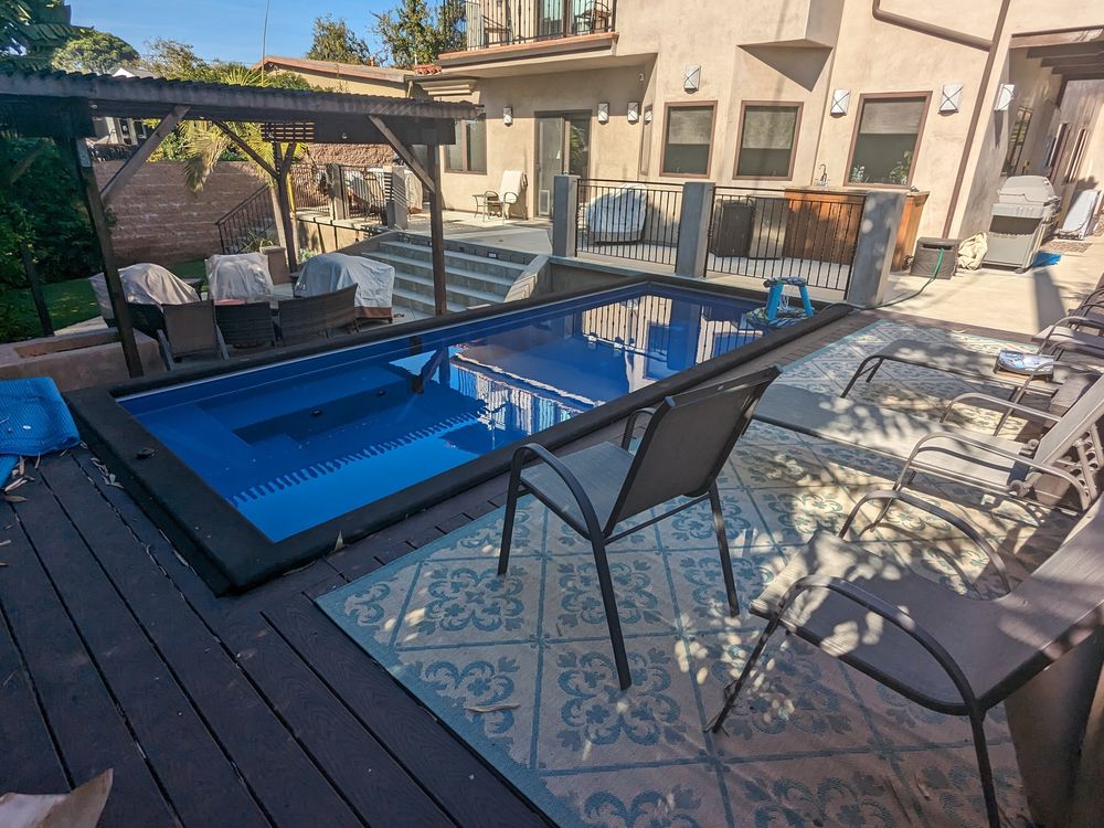 Plunge pool and pergola with artificial turf and a concrete patio (2022)